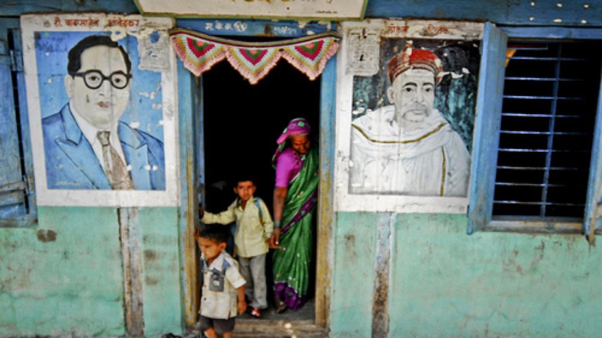 A microfinance self help group meet up at a local community center in a village