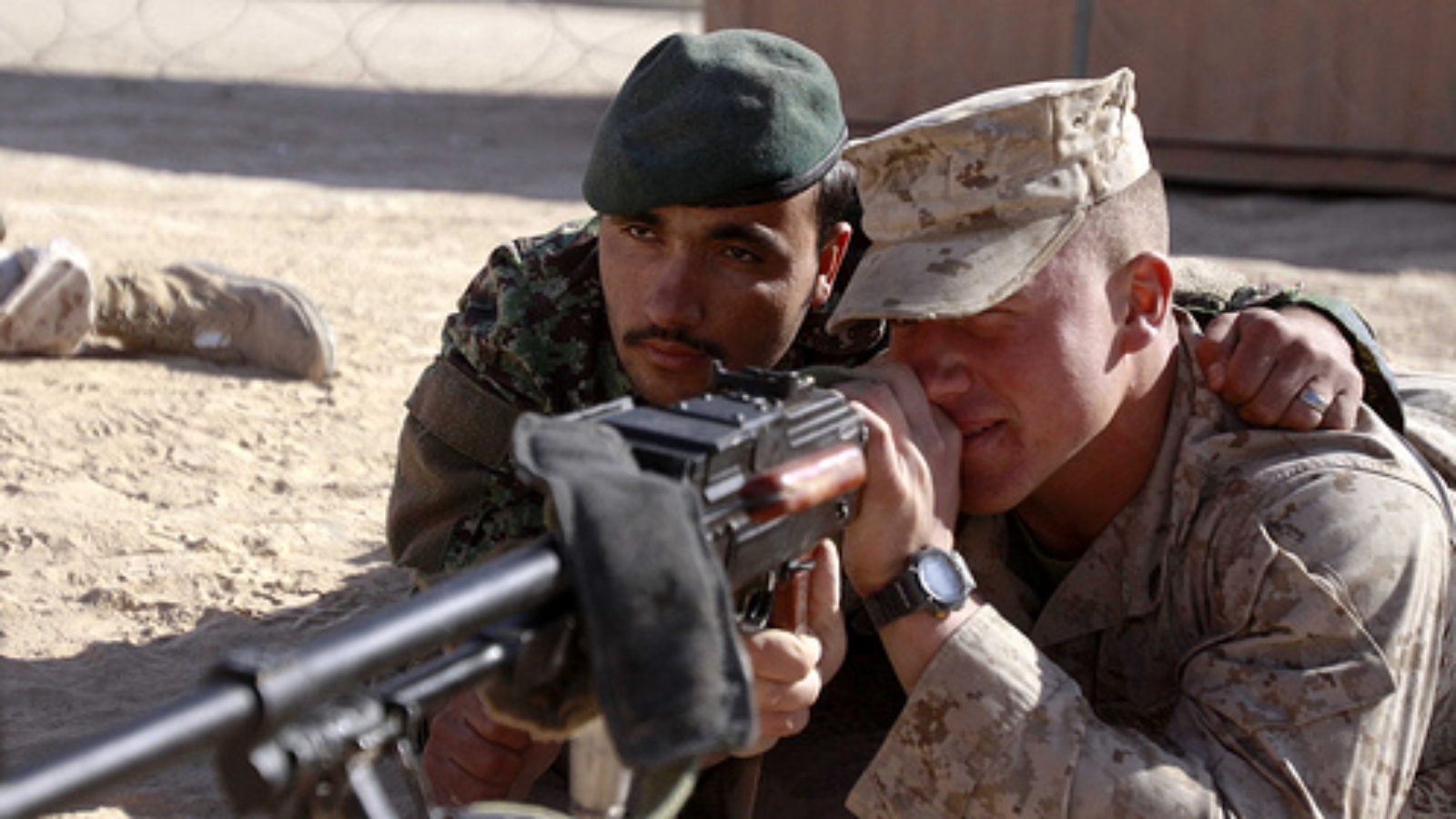 A U.S. Marine and Afghan National Army member at a weapons class in Afghanistan.