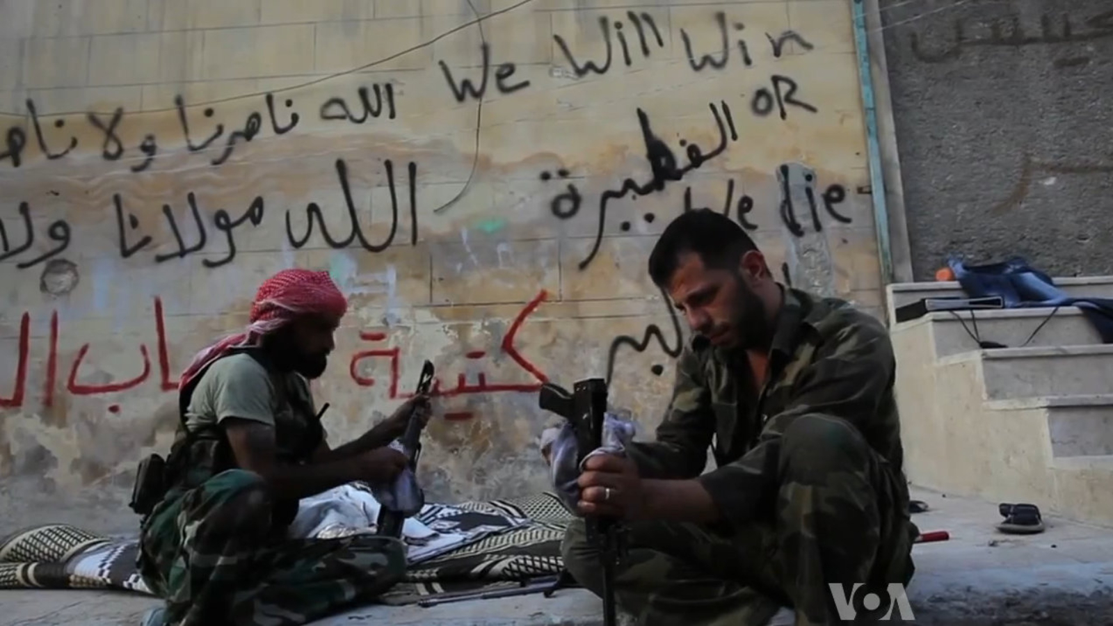 FSA_rebels_cleaning_their_AK47s.jpg