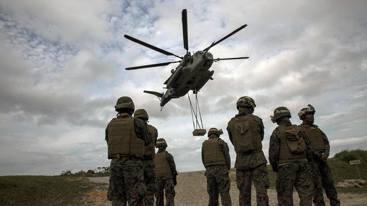 Marines conduct a helicopter support team exercise at Marine Corps Air Station Futenma, Okinawa, Japan, April 22, 2016. The Marines are landing support specialists, commonly referred to as red patchers, with Landing Support Detachment, 3rd Transportation Support Battalion, Combat Logistics Regiment 3, 3rd Marine Logistics Group, III Marine Expeditionary Force. (U.S. Marine Corps Photo by Lance Cpl. Nelson Duenas/Released)